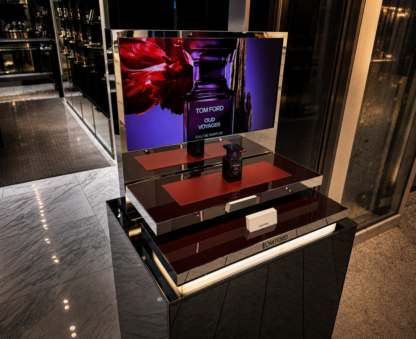 Tom Ford Oud Voyager countertop display with chromed metal, glass, and tinted mirrored finishes